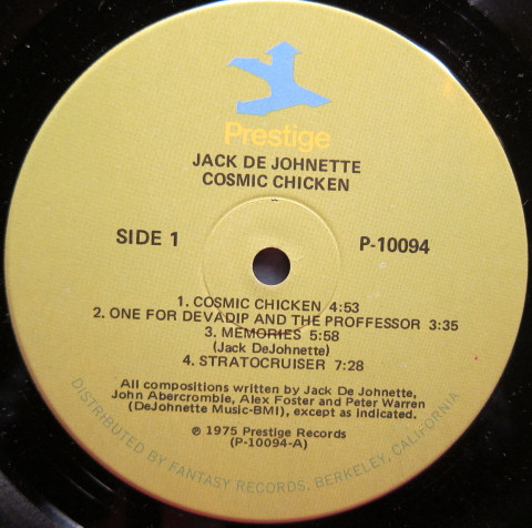 Jack DeJohnette's Directions - Cosmic Chicken LP NM or M- VG+ 1975 Prestige Jazz Fusion Vinyl: NM/M Cover: VG+ = Ultrasonic Cleaned on Kirmuss machine for superior audio and sonics! !!! This listing uses a stock photo. You will receive the exact pressing that the stock photo shows. We grade conservatively, and have been selling records/cd’s for over 25 years. Please inquire if you would like to see pictures of the actual item or have any questions. !!! - Image 3